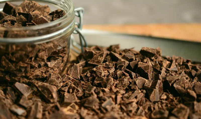 Dark chocolate pie filling is essentially a rich ganache lightened with eggs. The process requires careful temperature control and technique: