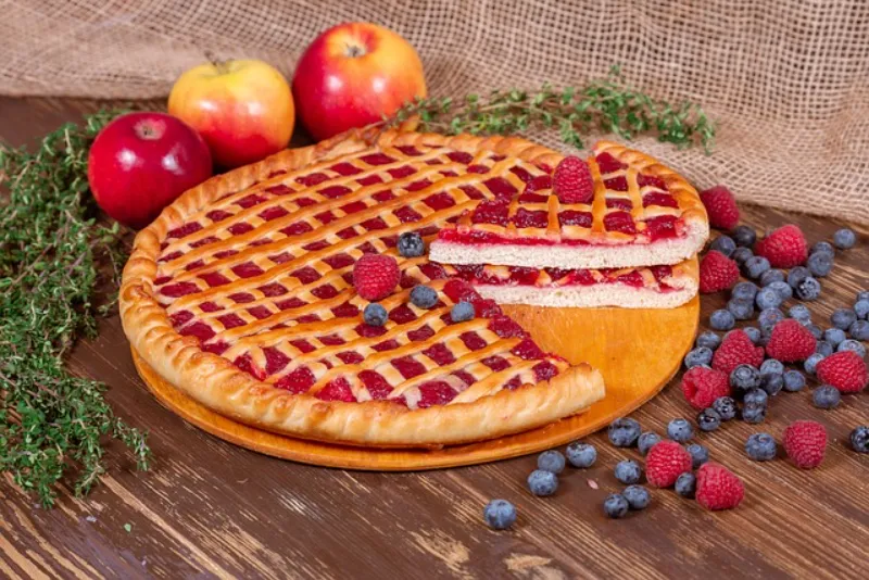 Raspberry pie showcases the delicate, intensely flavored raspberry in a buttery crust. These jewel-toned berries create a sophisticated pie with remarkable depth, balancing sweetness with gentle tartness and floral notes.